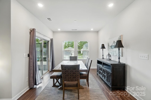 dining room with dark wood-style flooring, baseboards, and recessed lighting