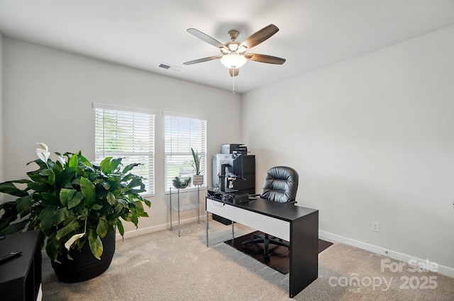 office area featuring baseboards, a ceiling fan, and carpet floors