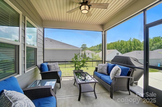 sunroom with an outdoor hangout area and ceiling fan