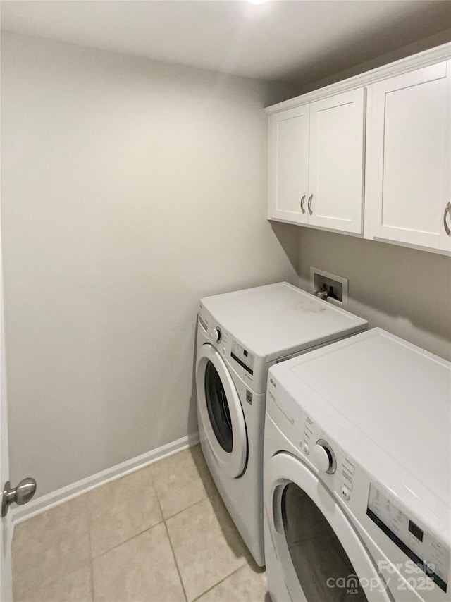 4105 Galloway Park Dr, Charlotte, NC 28262 - clothes washing area featuring cabinet space, washer and clothes dryer, baseboards, and light tile patterned floors