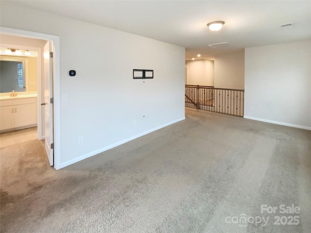 4105 Galloway Park Dr, Charlotte, NC 28262 - carpeted empty room with a sink and baseboards
