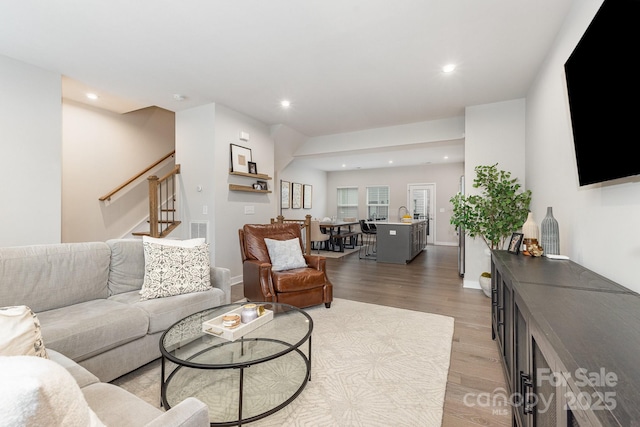 625 Uwharrie River Rd, Charlotte, NC 28211 - living room with light wood-style floors, stairs, recessed lighting, and baseboards