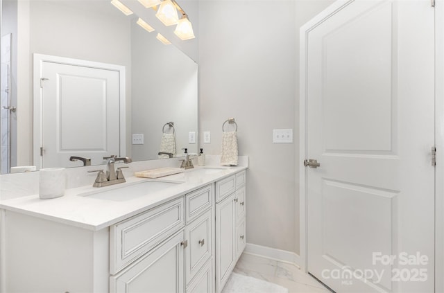 625 Uwharrie River Rd, Charlotte, NC 28211 - full bathroom with marble look tile flooring, double vanity, and baseboards