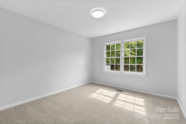 6412 Sullins Rd, Charlotte, NC 28214 - carpeted spare room featuring baseboards