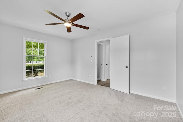 6412 Sullins Rd, Charlotte, NC 28214 - carpeted spare room featuring baseboards and a ceiling fan