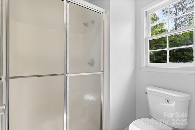 6412 Sullins Rd, Charlotte, NC 28214 - full bath featuring healthy amount of natural light, toilet, and a shower with door