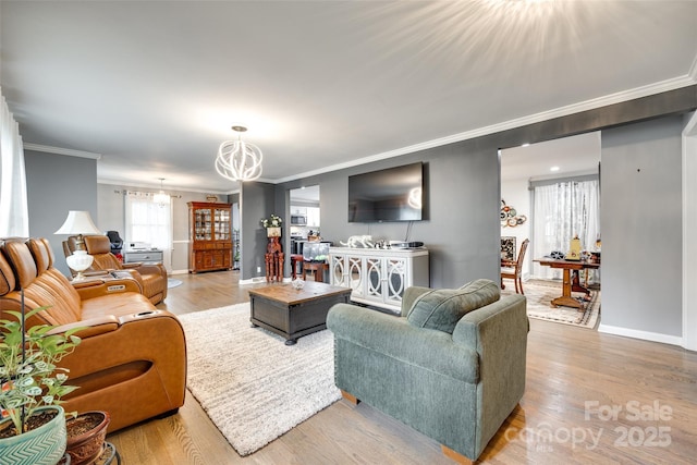 622 University Dr, Rock Hill, SC 29730 - living room with a chandelier, ornamental molding, wood finished floors, and baseboards