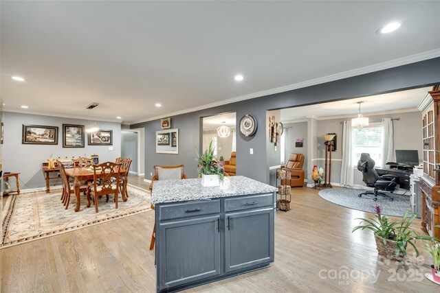 622 University Dr, Rock Hill, SC 29730 - kitchen featuring light wood-type flooring, recessed lighting, baseboards, crown molding, and a center island