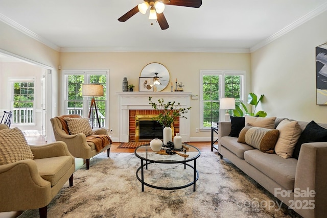 2725 Cotton Planter Ln, Charlotte, NC 28270 - living area with a ceiling fan, ornamental molding, plenty of natural light, a brick fireplace, and wood finished floors