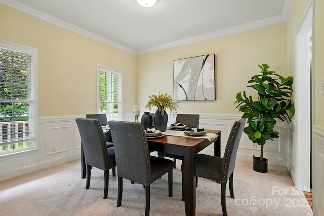 2725 Cotton Planter Ln, Charlotte, NC 28270 - dining space with light colored carpet, crown molding, a decorative wall, and wainscoting