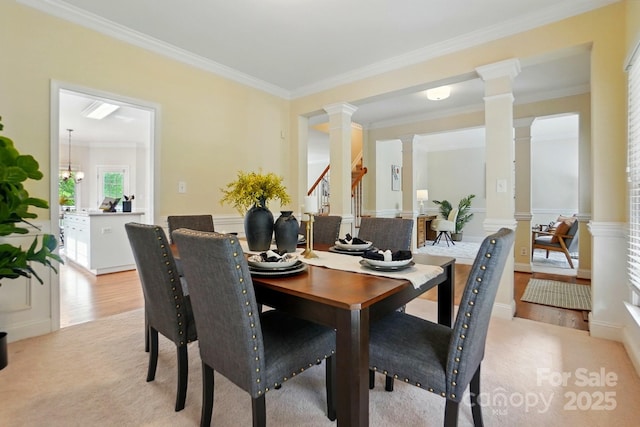 2725 Cotton Planter Ln, Charlotte, NC 28270 - dining room featuring ornate columns, crown molding, and light wood-style flooring