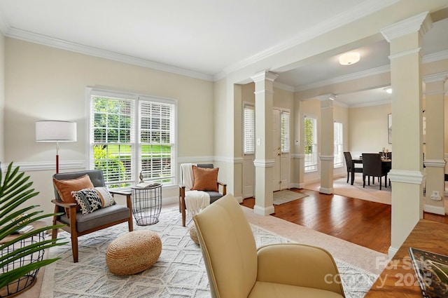 2725 Cotton Planter Ln, Charlotte, NC 28270 - living room featuring ornate columns, plenty of natural light, wood finished floors, ornamental molding, and baseboards