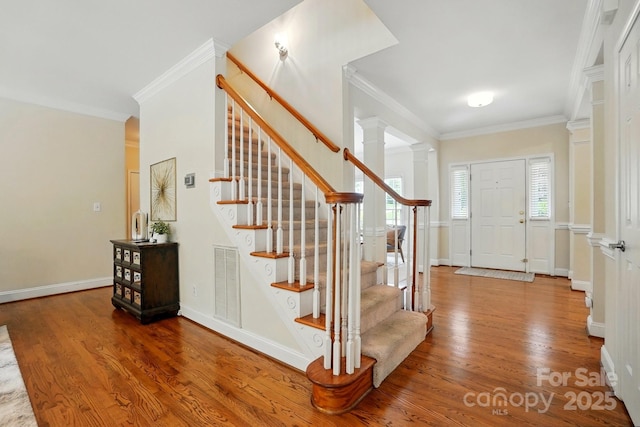2725 Cotton Planter Ln, Charlotte, NC 28270 - foyer entrance with wood finished floors, ornamental molding, stairs, and baseboards