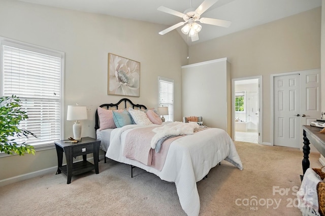 2725 Cotton Planter Ln, Charlotte, NC 28270 - bedroom with light carpet, multiple windows, connected bathroom, baseboards, and high vaulted ceiling