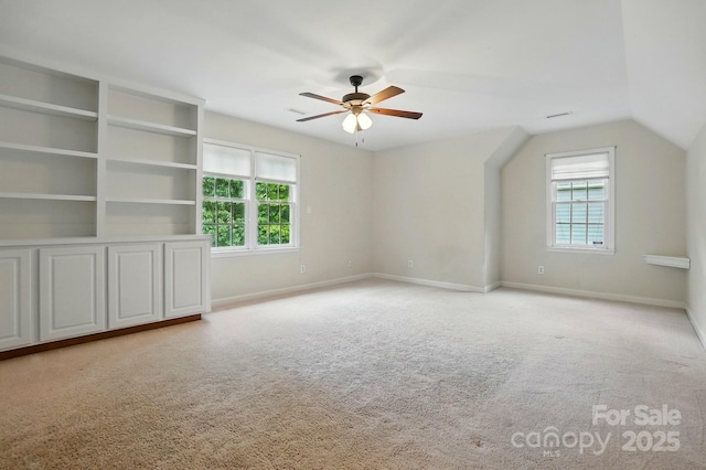 2725 Cotton Planter Ln, Charlotte, NC 28270 - additional living space with healthy amount of natural light, carpet, ceiling fan, and lofted ceiling