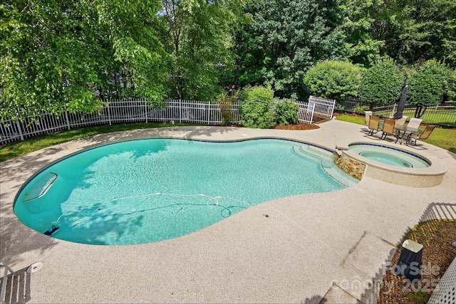 2725 Cotton Planter Ln, Charlotte, NC 28270 - view of swimming pool featuring a patio, a fenced backyard, a pool with connected hot tub, and view of wooded area