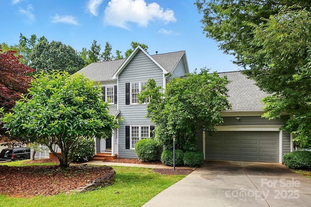 2725 Cotton Planter Ln, Charlotte, NC 28270 - view of front facade with concrete driveway, roof with shingles, and a garage