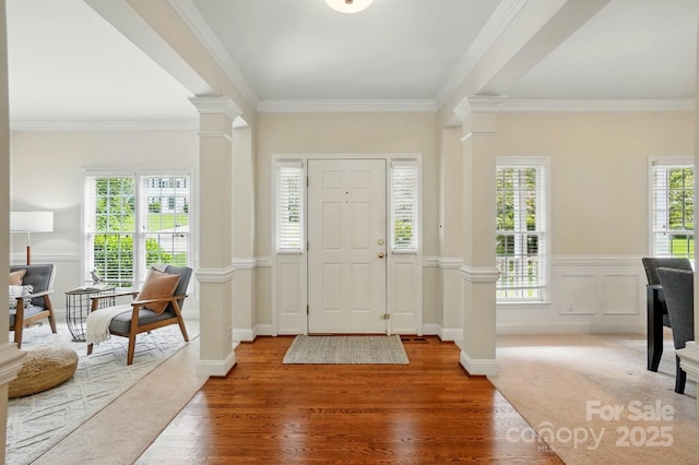 2725 Cotton Planter Ln, Charlotte, NC 28270 - entrance foyer with decorative columns, wood finished floors, and crown molding