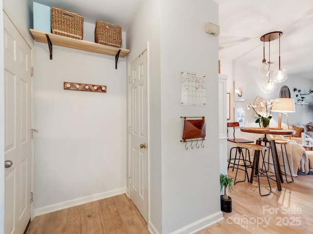 3308 Selwyn Farms Ln Unit 2, Charlotte, NC 28209 - hallway featuring light wood finished floors and baseboards