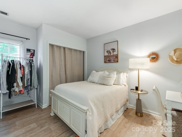 3308 Selwyn Farms Ln Unit 2, Charlotte, NC 28209 - bedroom featuring light wood-style floors and baseboards
