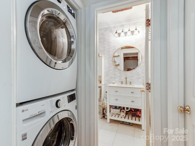 3308 Selwyn Farms Ln Unit 2, Charlotte, NC 28209 - washroom featuring stacked washing machine and dryer and light tile patterned floors