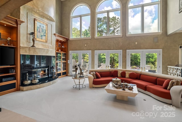 2971 Kaneland Ct, Rock Hill, SC 29732 - carpeted living area with a towering ceiling, french doors, and healthy amount of natural light
