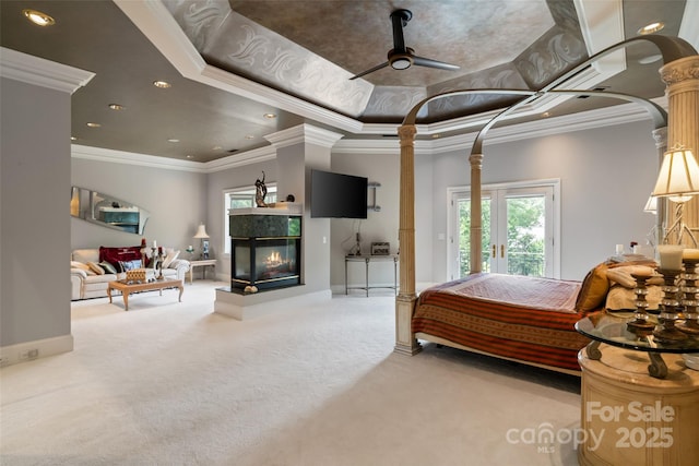 2971 Kaneland Ct, Rock Hill, SC 29732 - carpeted bedroom with crown molding, a multi sided fireplace, baseboards, access to outside, and ornate columns