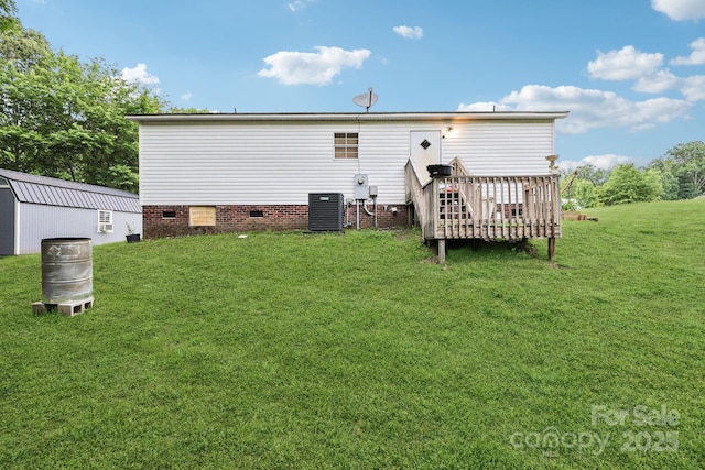 103 Palace Pt, Kings Mountain, NC 28086 - rear view of house with a lawn, crawl space, a wooden deck, and central AC unit