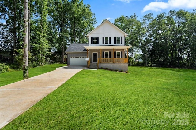 4541 Kings Ct, Hickory, NC 28602 - view of front facade with covered porch, a front yard, an attached garage, and driveway