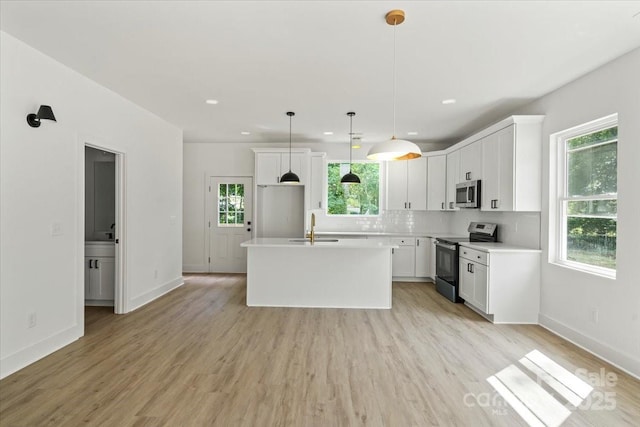 4541 Kings Ct, Hickory, NC 28602 - kitchen with stainless steel appliances, a sink, white cabinets, and recessed lighting