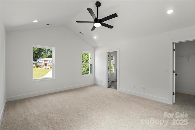 4541 Kings Ct, Hickory, NC 28602 - unfurnished bedroom featuring multiple windows, a walk in closet, recessed lighting, carpet floors, and baseboards