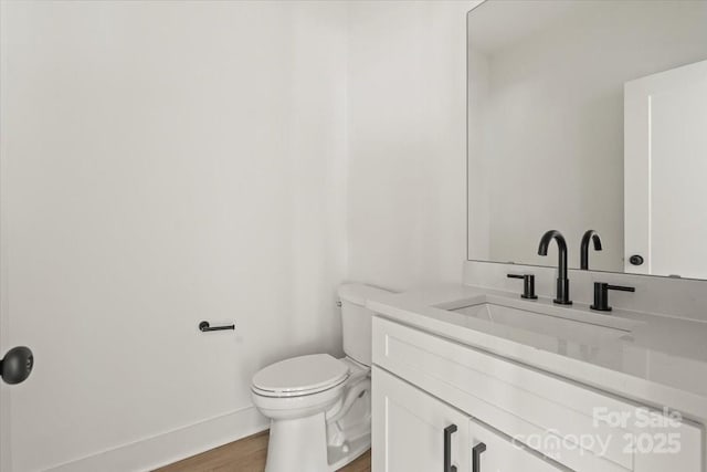 4541 Kings Ct, Hickory, NC 28602 - bathroom featuring wood finished floors, toilet, vanity, and baseboards