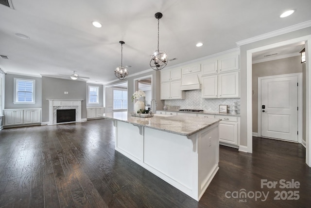 295 Helton Ln, Fort Mill, SC 29708 - kitchen with ceiling fan, crown molding, white cabinetry, a chandelier, and light stone countertops