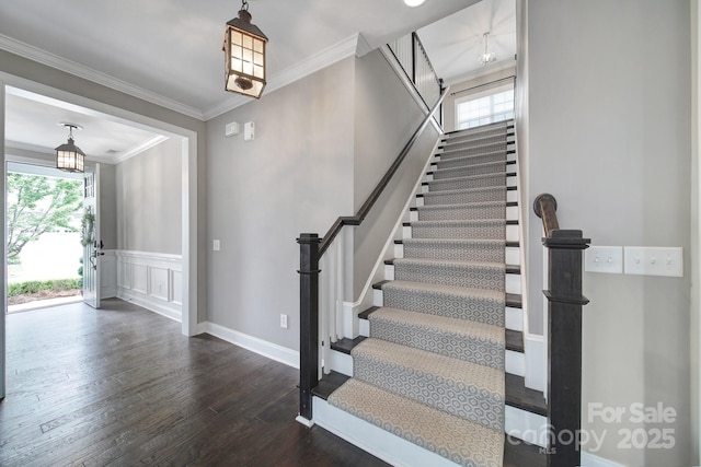 295 Helton Ln, Fort Mill, SC 29708 - entryway featuring plenty of natural light, dark wood-style floors, stairs, crown molding, and wainscoting