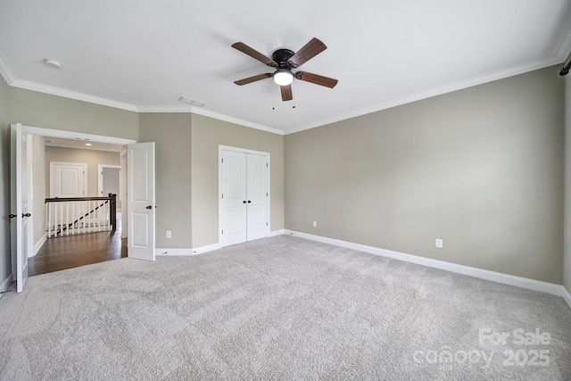 295 Helton Ln, Fort Mill, SC 29708 - unfurnished bedroom featuring carpet flooring, baseboards, ornamental molding, a closet, and ceiling fan