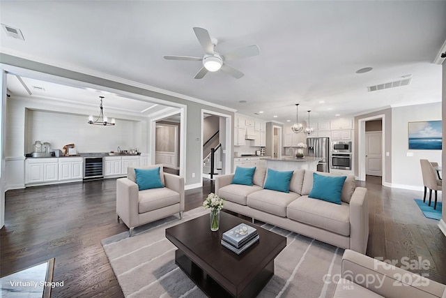 295 Helton Ln, Fort Mill, SC 29708 - living room with wine cooler, a chandelier, dark wood-style flooring, stairway, and ceiling fan
