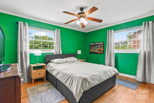 27 Dixon Ter, Candler, NC 28715 - bedroom with wood finished floors and ceiling fan