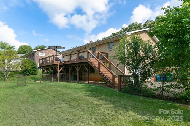 27 Dixon Ter, Candler, NC 28715 - rear view of property with a deck, brick siding, stairway, and a chimney