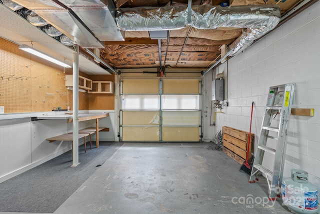 27 Dixon Ter, Candler, NC 28715 - garage featuring concrete block wall and water heater