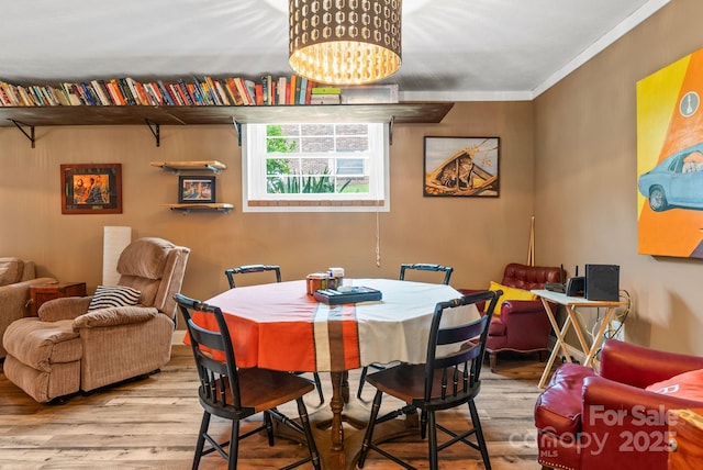 27 Dixon Ter, Candler, NC 28715 - dining space with wood finished floors, ornamental molding, and a chandelier
