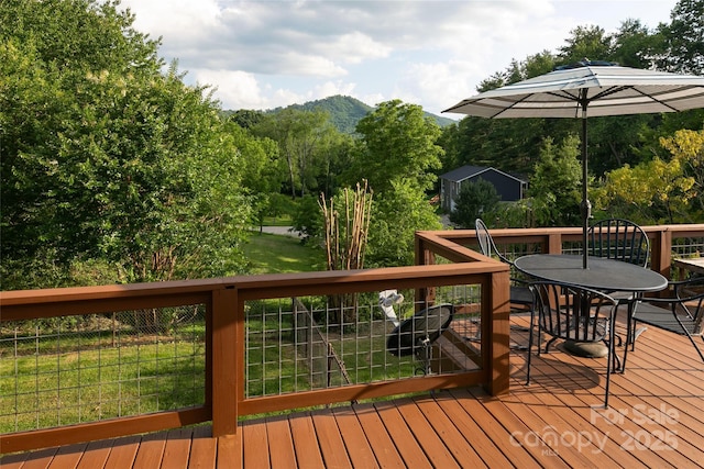 27 Dixon Ter, Candler, NC 28715 - deck featuring outdoor dining area, a lawn, and a mountain view