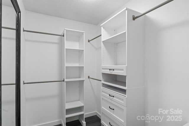3103 Suggs St, Belmont, NC 28012 - spacious closet featuring dark wood-style flooring