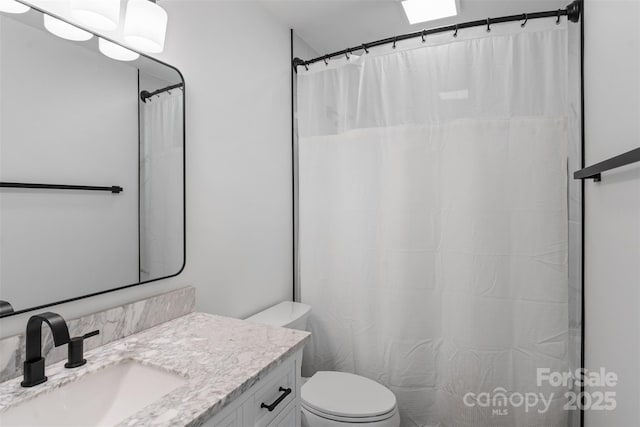 3103 Suggs St, Belmont, NC 28012 - full bath featuring vanity, toilet, and a shower with shower curtain