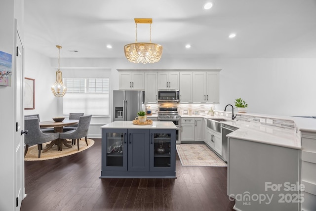 15913 Trenton Place Rd, Huntersville, NC 28078 - kitchen featuring stainless steel appliances, a chandelier, a sink, light countertops, and recessed lighting