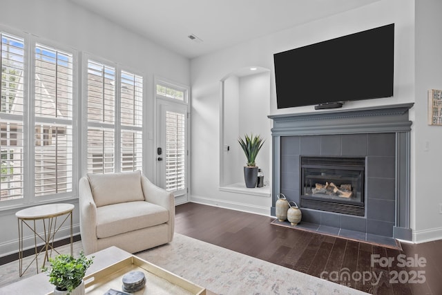 15913 Trenton Place Rd, Huntersville, NC 28078 - living room featuring wood finished floors, baseboards, and a tile fireplace