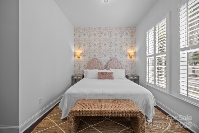15913 Trenton Place Rd, Huntersville, NC 28078 - bedroom with multiple windows, wallpapered walls, baseboards, and an accent wall