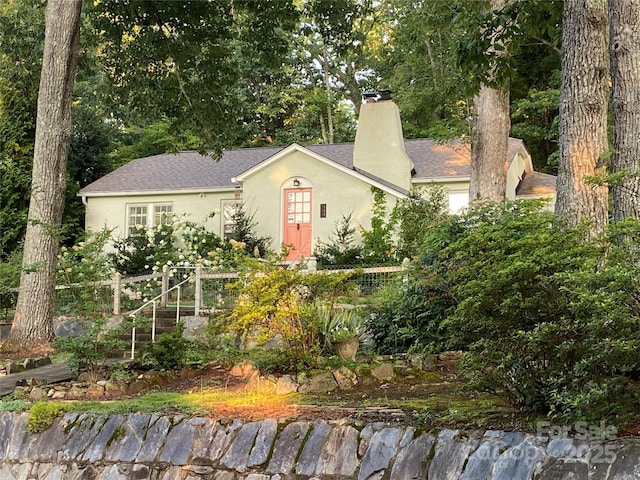 160 Hidden Hill Rd, Tryon, NC 28782 - view of front of house with a chimney, stucco siding, and roof with shingles