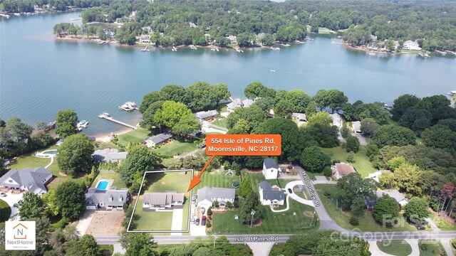 554 Isle Of Pines Rd, Mooresville, NC 28117 - aerial overview of property's location featuring a large body of water, property boundaries highlighted, and a heavily wooded area