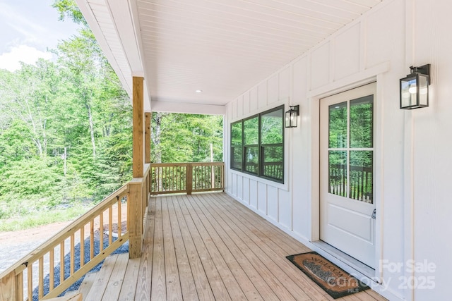 wooden terrace featuring a porch