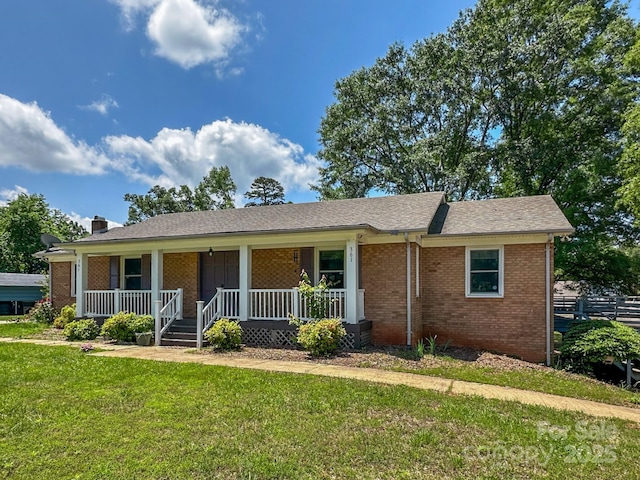 361 Settlemyer Rd, Morganton, NC 28655 - ranch-style home with brick siding, a porch, a front yard, and a chimney